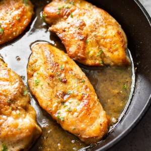 honey soy garlic chicken in a cast iron skillet