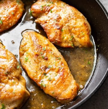 honey soy garlic chicken in a cast iron skillet