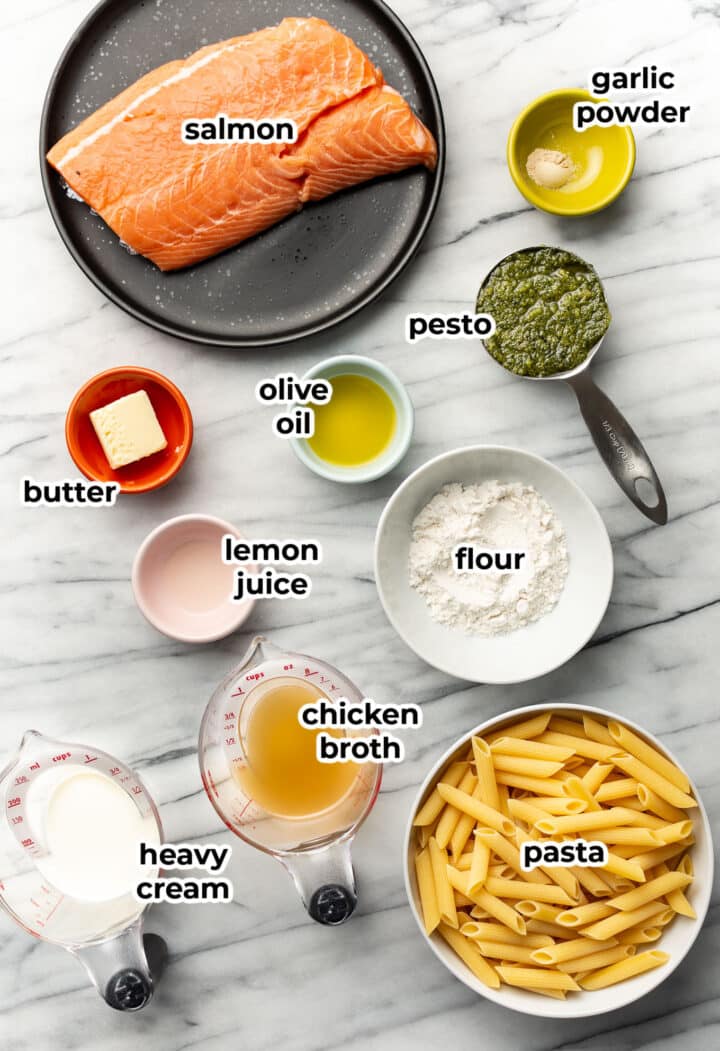ingredients for salmon pesto pasta in prep bowls and measuring cups