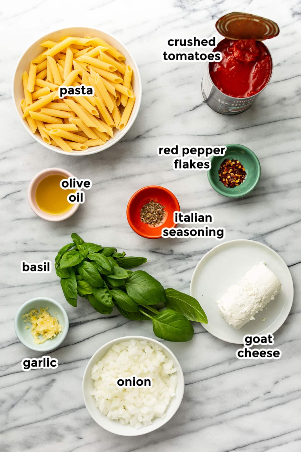 ingredients for tomato goat cheese pasta in prep bowls