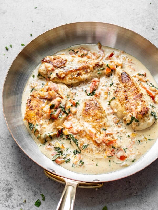 creamy tomato and basil chicken in a skillet