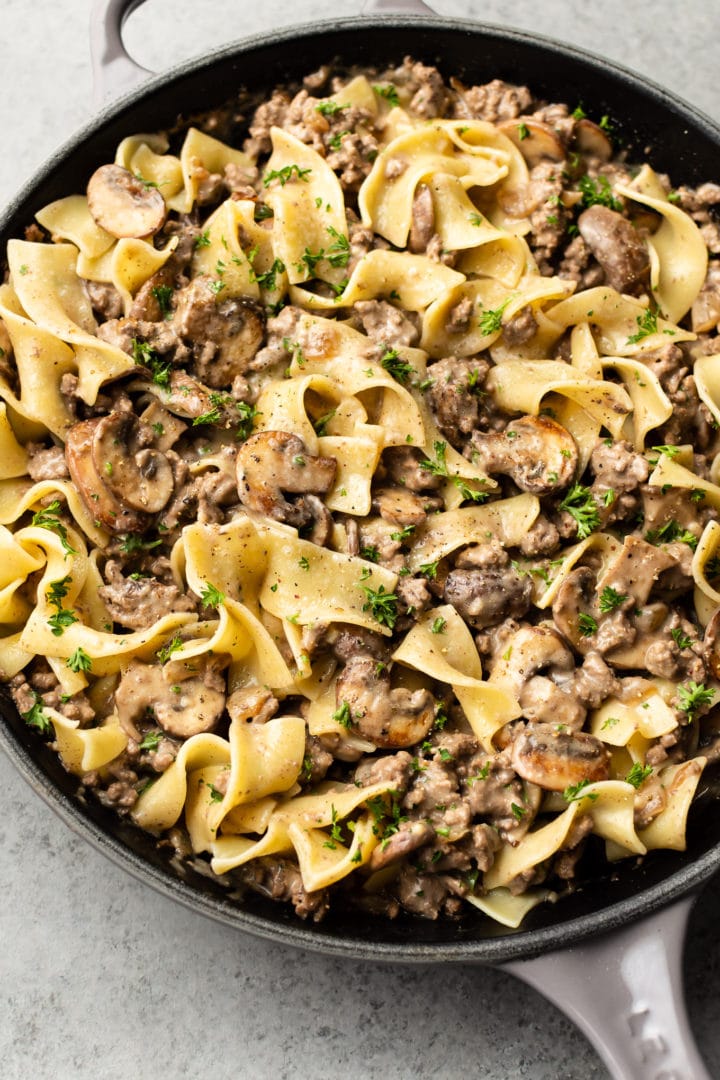 ground beef stroganoff with egg noodles in a skillet