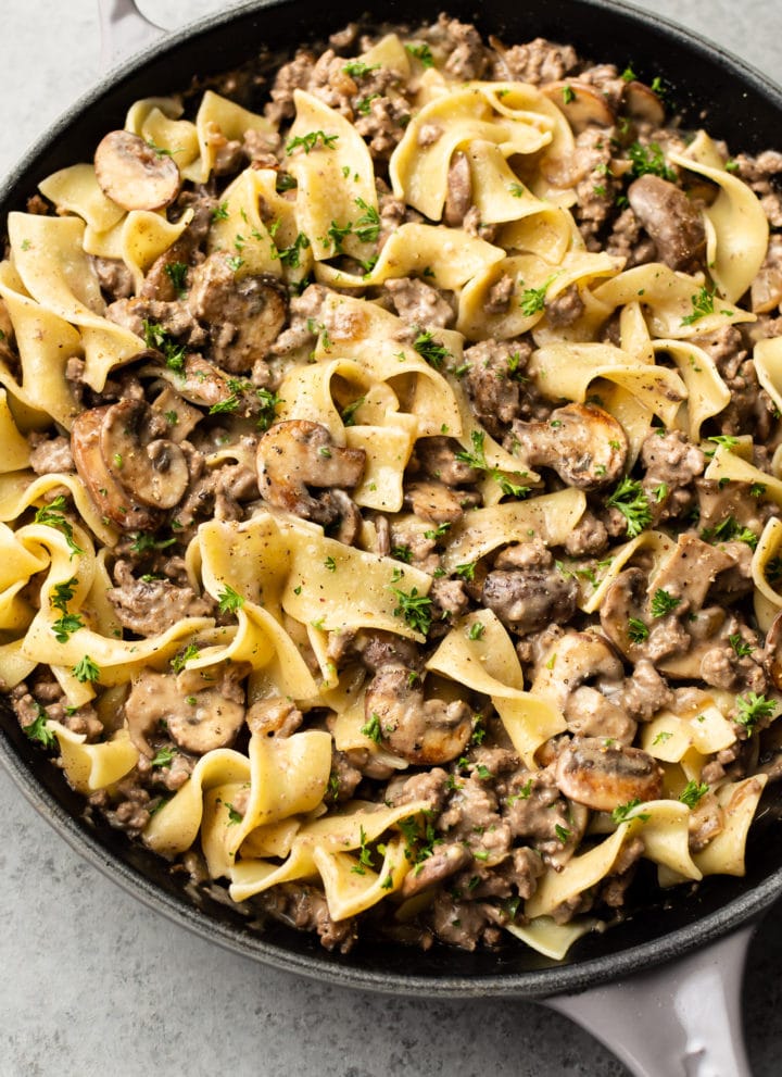 ground beef stroganoff with egg noodles in a skillet
