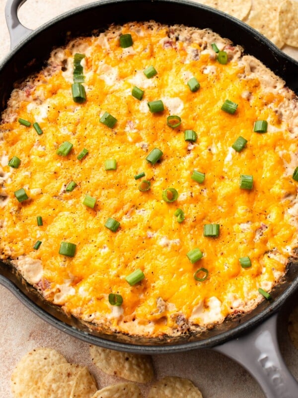 warm Rotel sausage dip in a cast iron skillet surrounded by tortilla chips