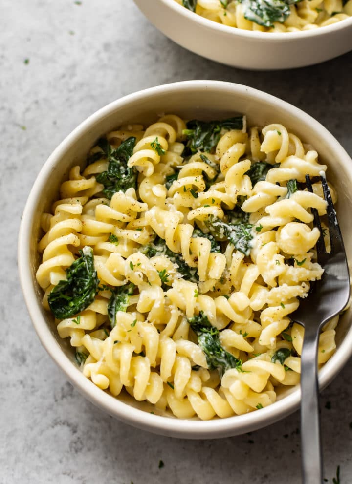 spinach goat cheese pasta in two bowls
