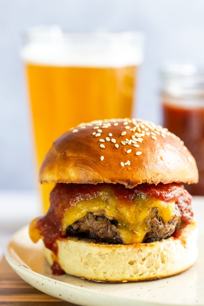 BBQ cheeseburgers with a glass of beer