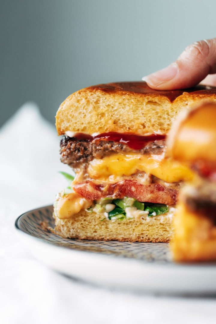 Juicy Lucy burgers (cut in half and cheese coming out)