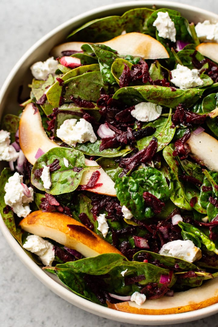 close-up of beet spinach salad in a bowl