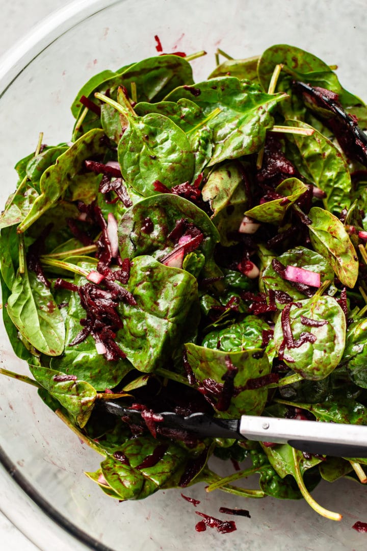 spinach beet salad in a glass prep bowl