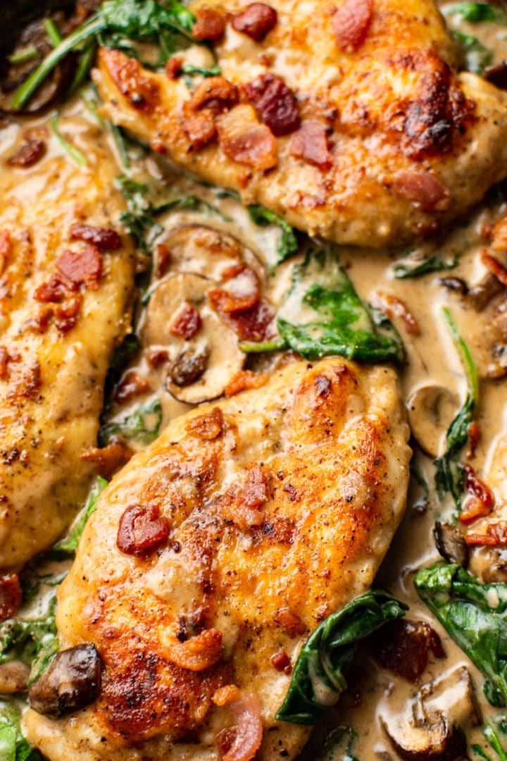 close-up of balsamic creamy spinach chicken with bacon and mushrooms