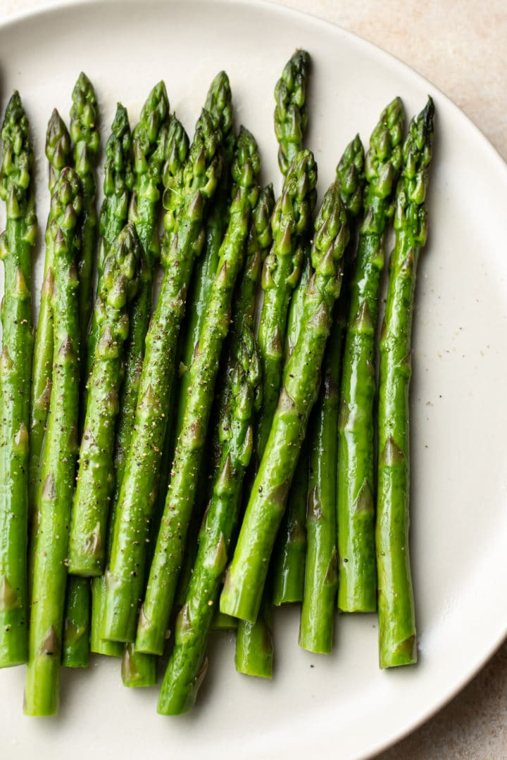 the best asparagus on a beige plate