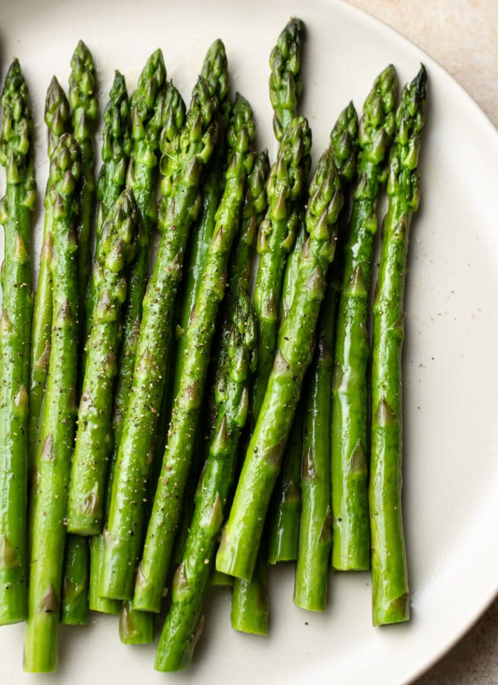 the best asparagus on a beige plate