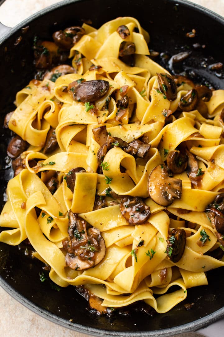 close-up of garlic mushroom pasta (in a skillet)