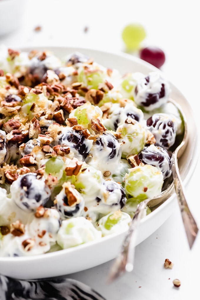 lightened up grape salad in white bowl