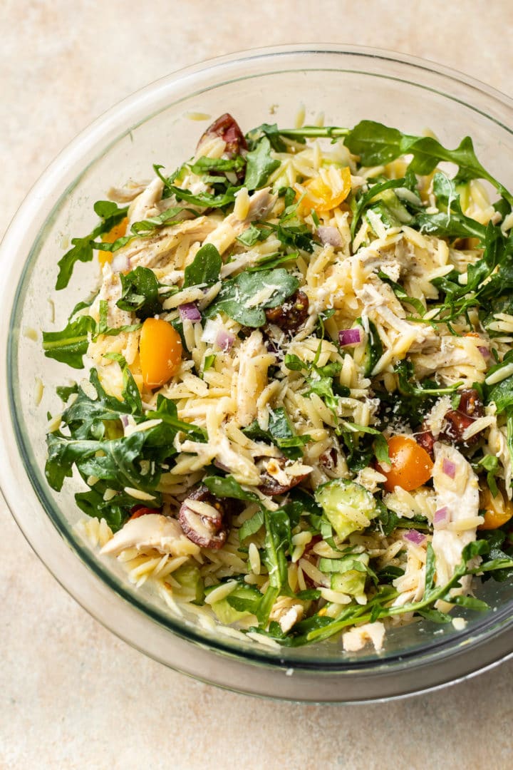 lemon orzo pasta salad with chicken in a glass prep bowl