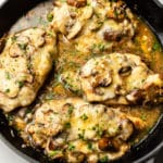 mozzarella mushroom white wine chicken in a gray Le Creuset skillet