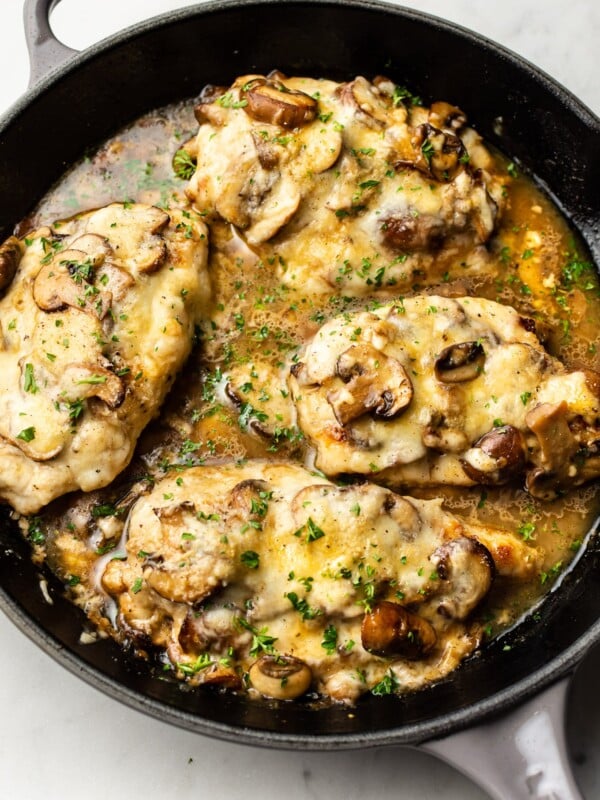 mozzarella mushroom white wine chicken in a gray Le Creuset skillet