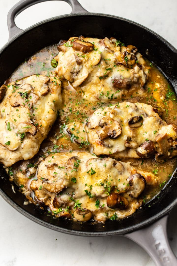 mozzarella mushroom white wine chicken in a gray Le Creuset skillet