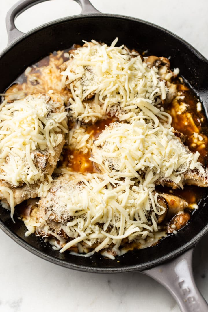 mozzarella mushroom white wine chicken ready for the oven (cheeses aren't melted yet in the photo)