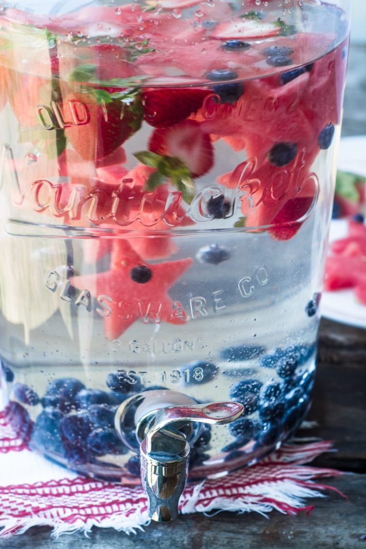 pitcher with patriotic cut out watermelon (star shapes) and blueberries