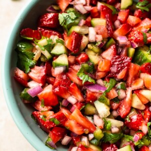 close-up of the best strawberry salsa in a turquoise bowl