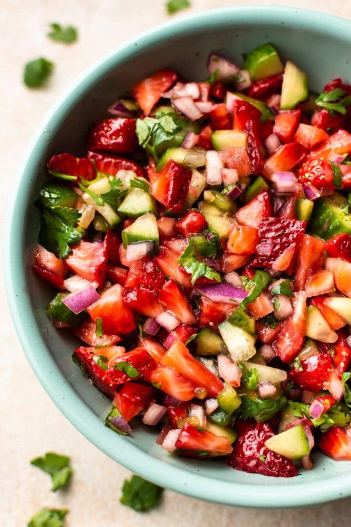 close-up of the best strawberry salsa in a turquoise bowl