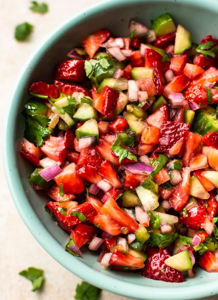 close-up of the best strawberry salsa in a turquoise bowl