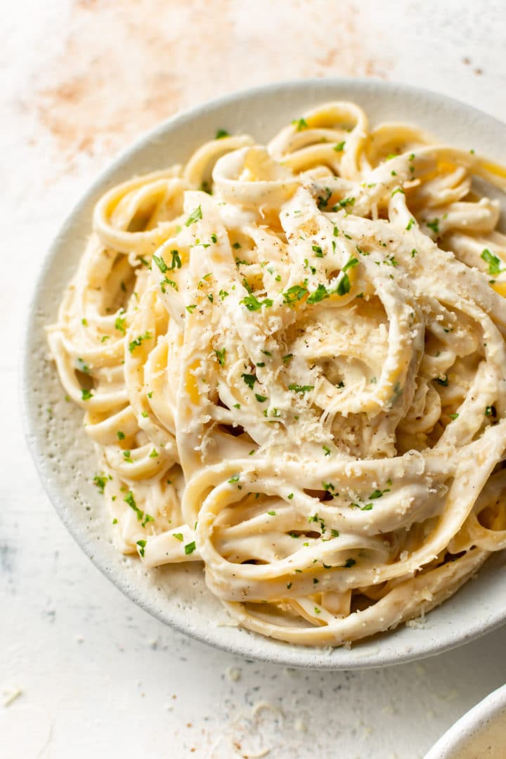 easy Alfredo sauce with cream cheese (Fettuccine Alfredo) in a white bowl