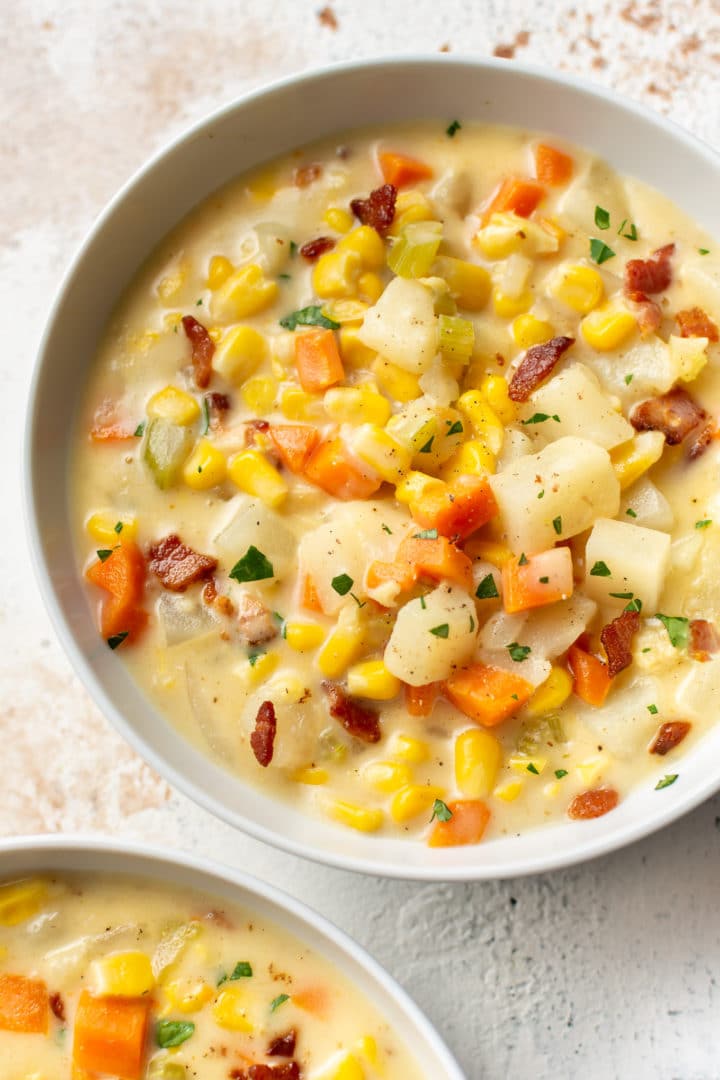 corn chowder in two white bowls