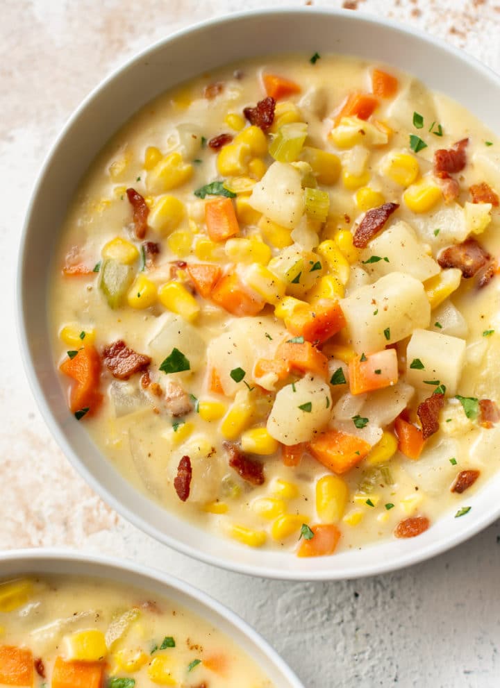 corn chowder in two white bowls