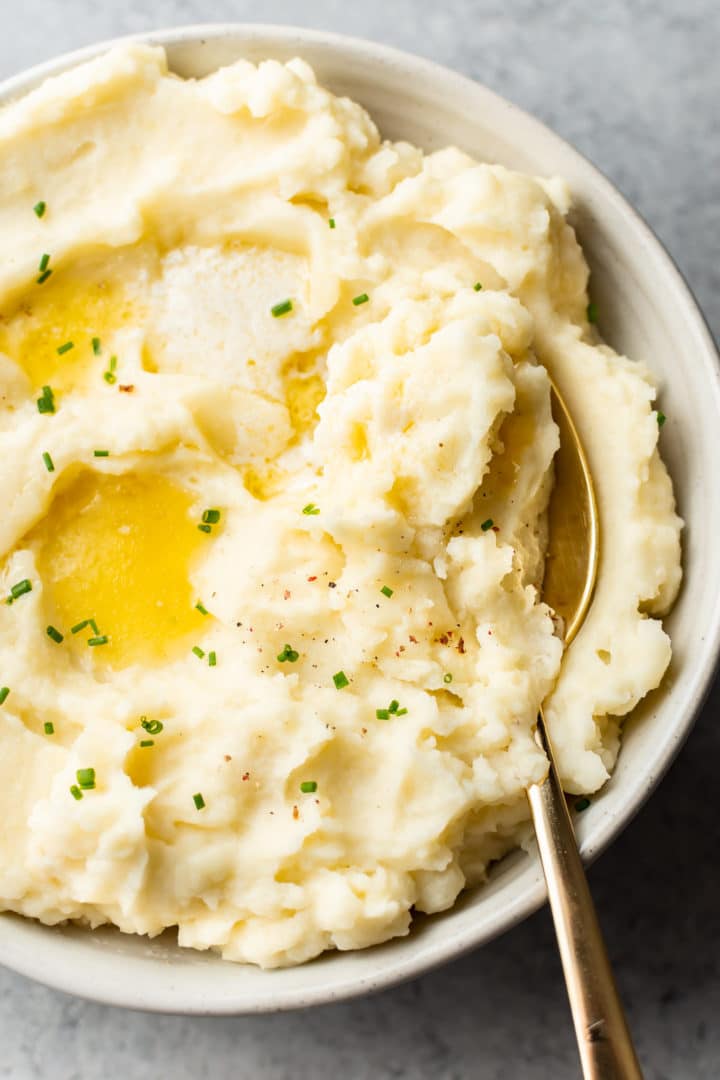 close-up of creamy garlic mashed potatoes in a serving bowl