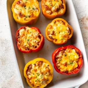 the best classic ground beef stuffed peppers in a white baking dish