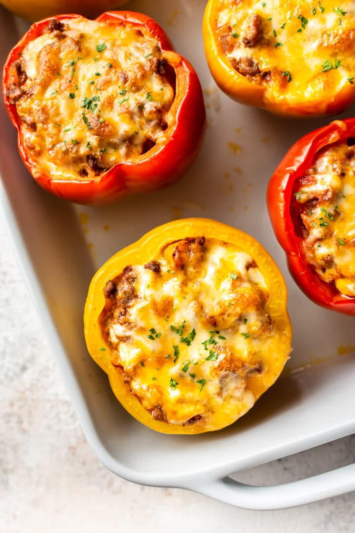 close-up of ground beef stuffed peppers (in a baking dish)