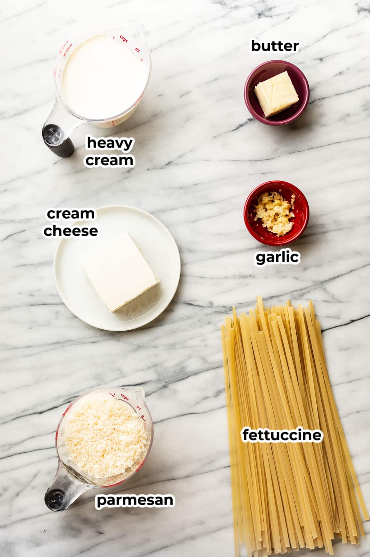 ingredients for fettuccine alfredo in prep bowls