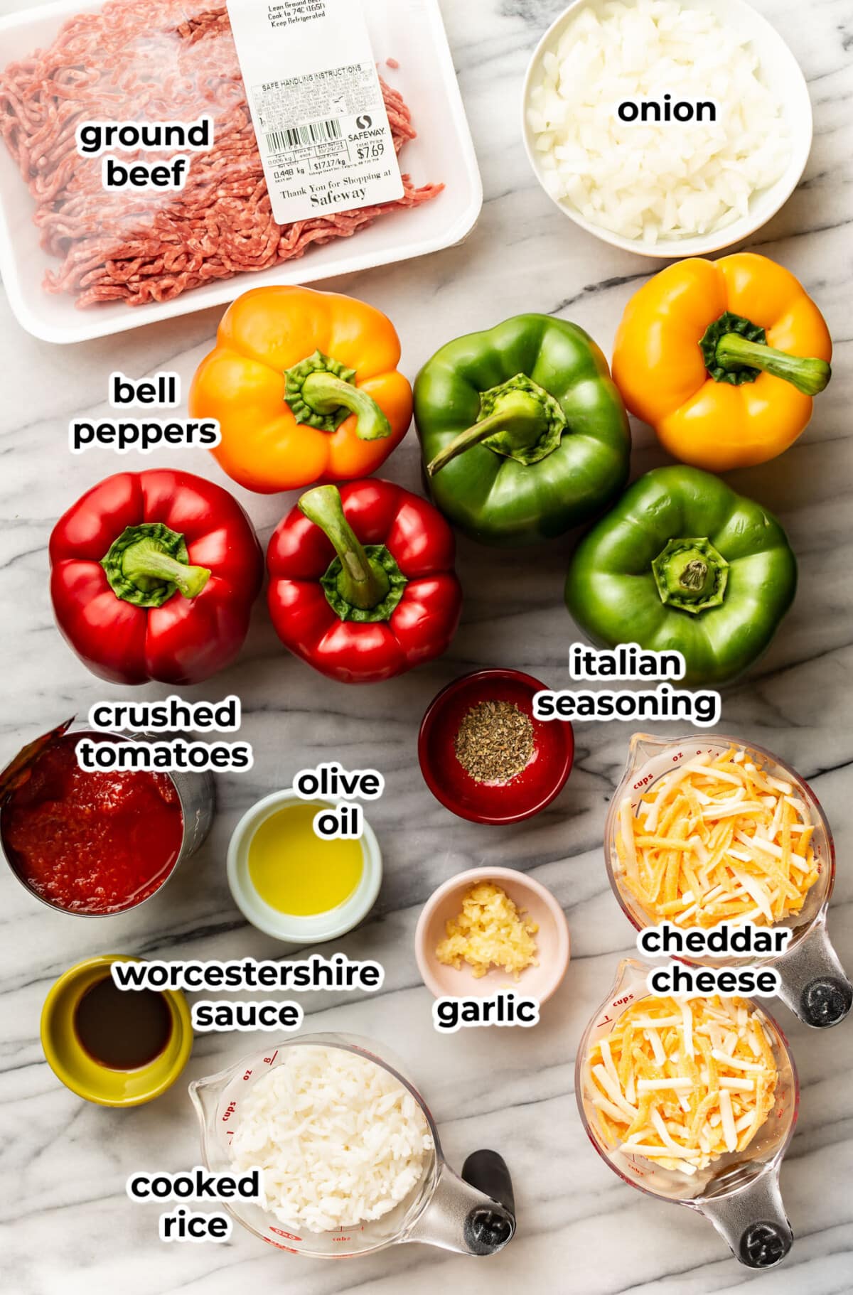 ingredients for ground beef stuffed peppers in prep bowls on a counter