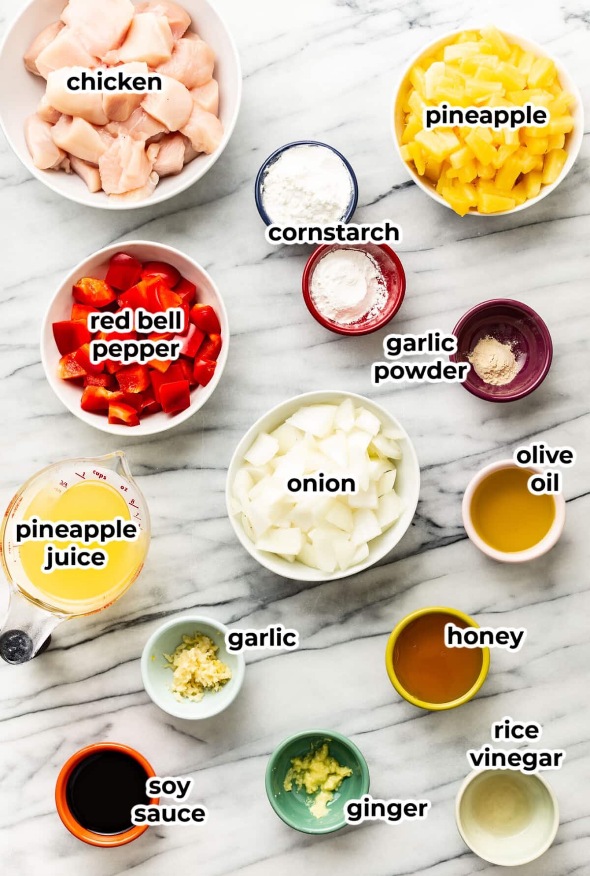 ingredients for pineapple chicken in prep bowls