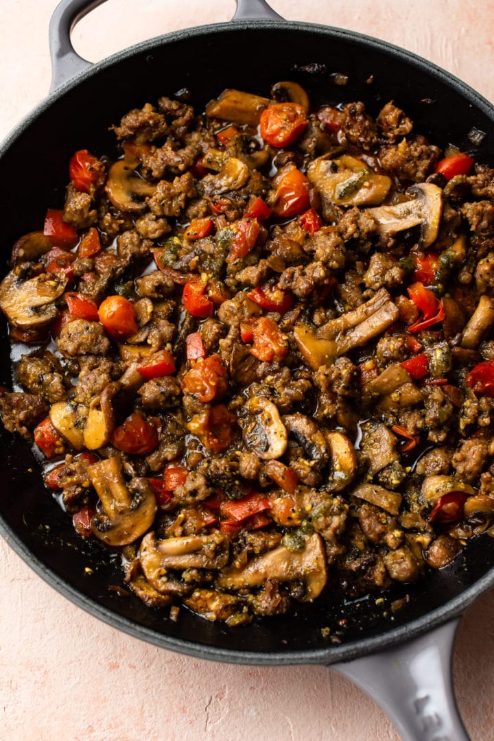 pesto sausage pasta sauce in a skillet