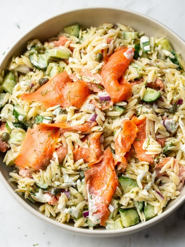 smoked salmon pasta salad in a beige serving bowl
