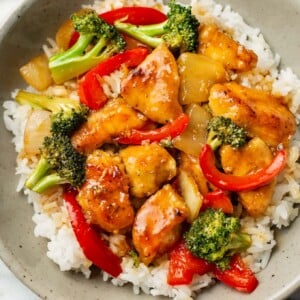 a bowl of teriyaki chicken stir fry over rice