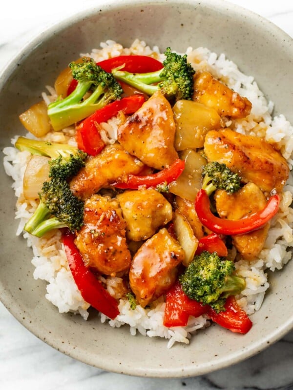 a bowl of teriyaki chicken stir fry over rice