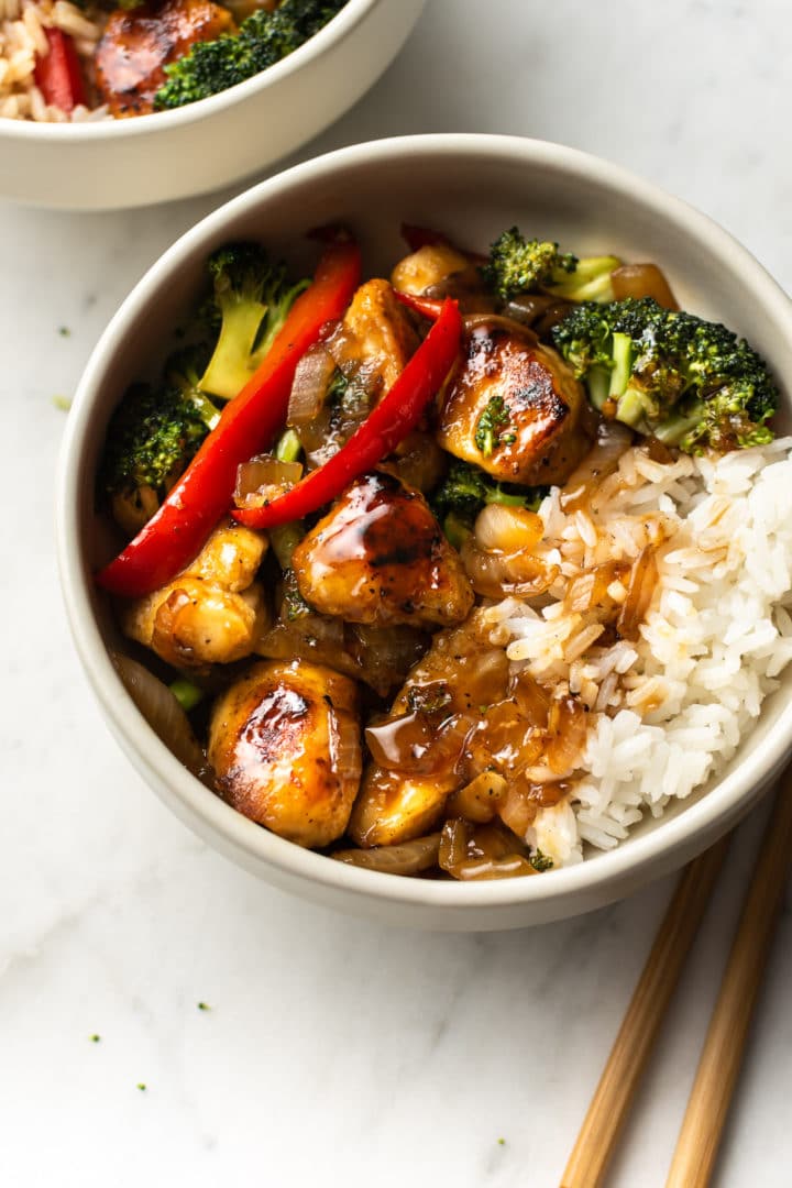 teriyaki chicken stir fry with rice in two bowls