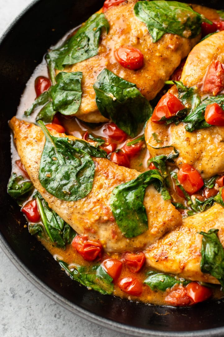 close-up of tomato spinach white wine chicken