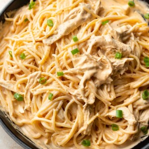 close-up of creamy buffalo chicken pasta (sauce and spaghetti) in a skillet