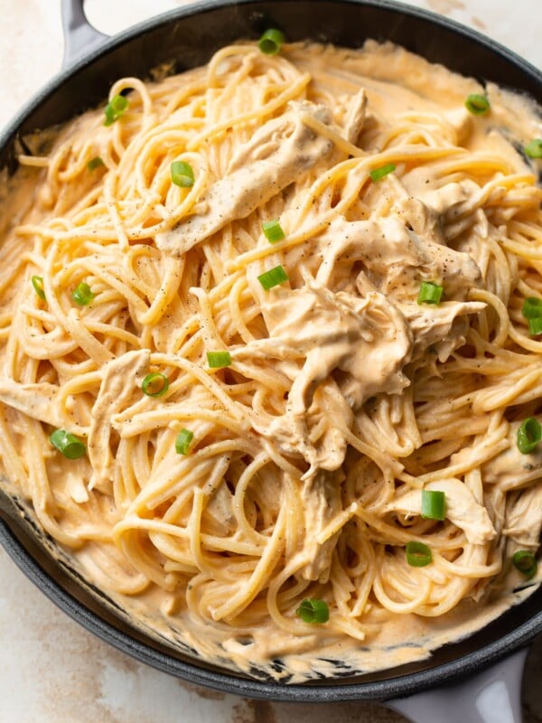 close-up of creamy buffalo chicken pasta (sauce and spaghetti) in a skillet