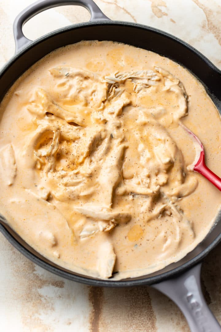 cheesy buffalo chicken pasta sauce in a skillet