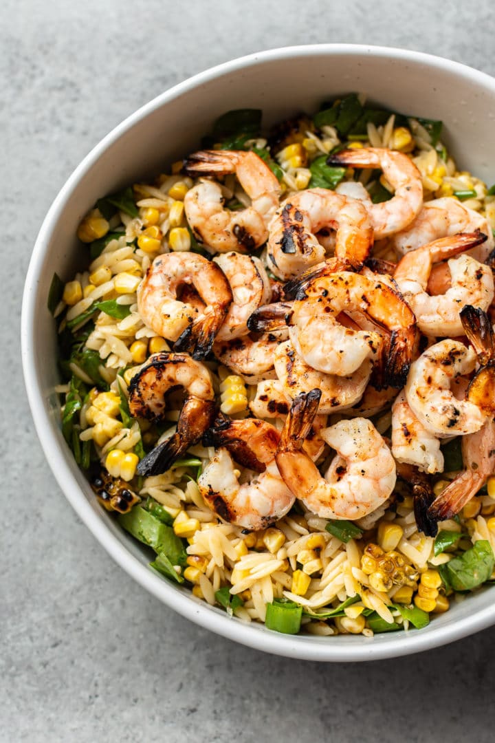 close-up of Cajun grilled shrimp and orzo salad in a big salad bowl