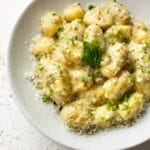 pesto gnocchi in a white bowl