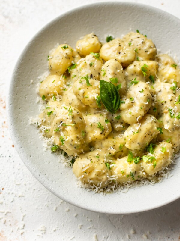 pesto gnocchi in a white bowl