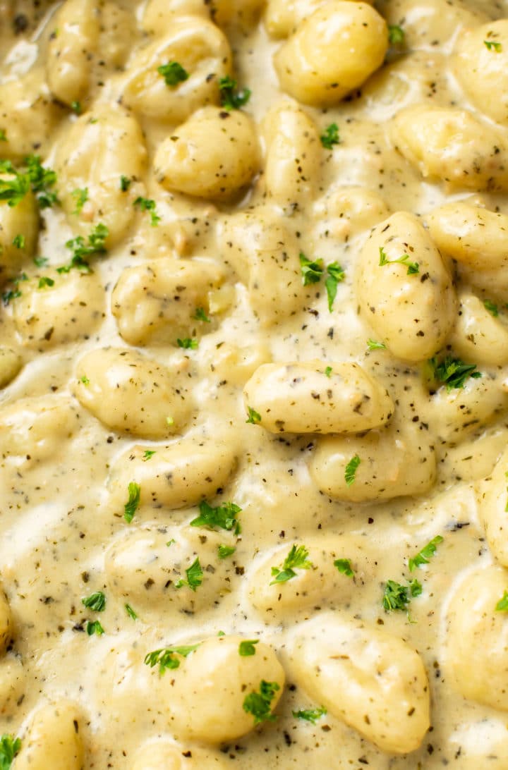 close-up of creamy pesto gnocchi