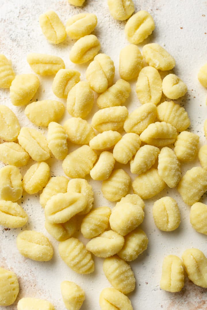 uncooked gnocchi on a white background